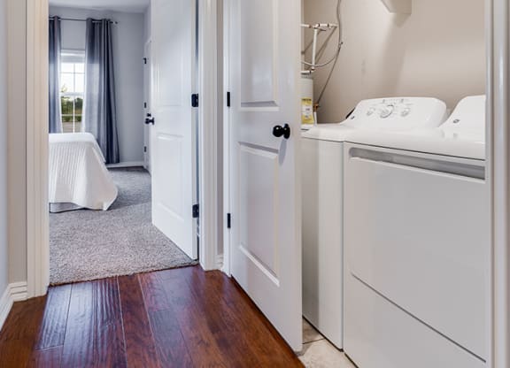 Tiled Closet with Washer and Dryer