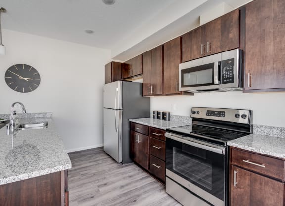 Kitchen With Granite Countertops & Stainless Steel Appliances