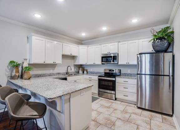 Open Kitchen with White Cabinetry