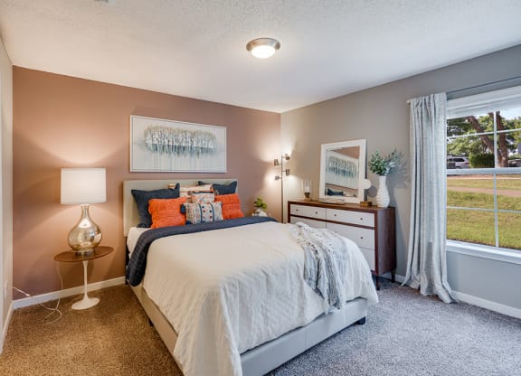 Bedroom with Plush Carpet and Large Window