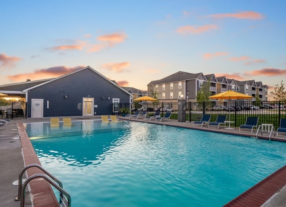 Outdoor Pool & Sundeck At Dusk