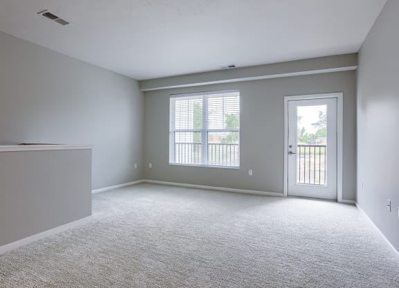 Spacious Living Area with Carpet
