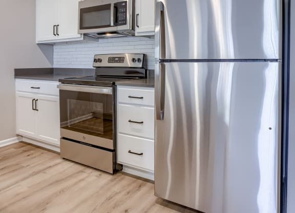 Kitchen with White Cabinetry and Stainless Steel Appliances