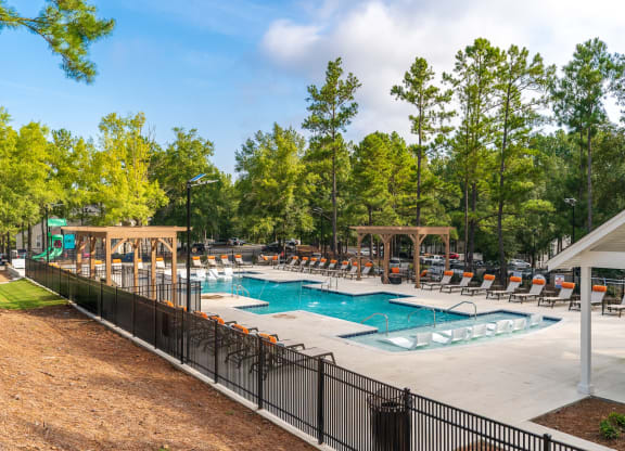 Expansive Pool Sundeck With Pergolas