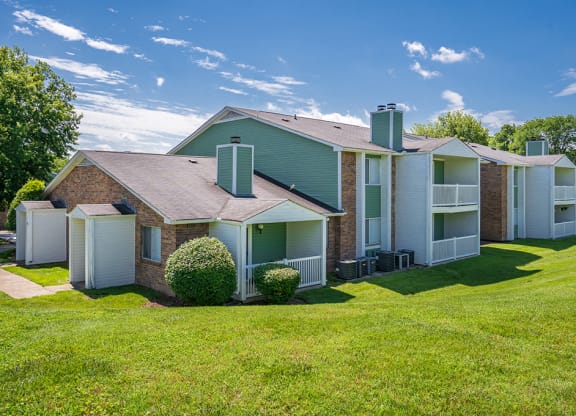 Lush Green Grass in Front of a Rivergate Meadows Apartment Building
