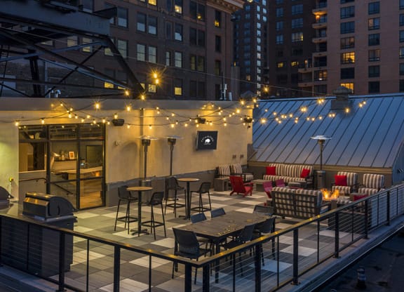 Rooftop Patio with fire pit and big screen TV