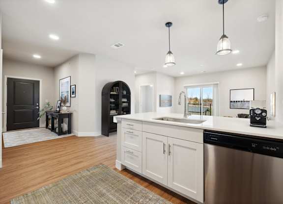 Kitchen with White Cabinetry and Stainless Steel Appliances