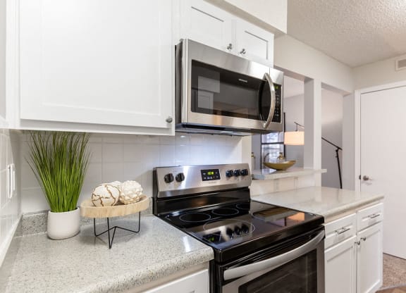 Kitchen with Stainless Steel Microwave and Oven