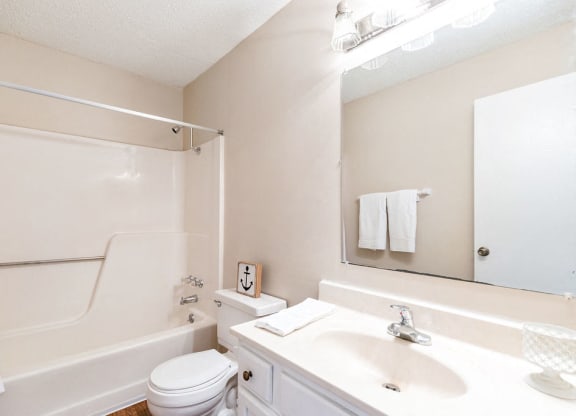 Classic Bathroom with White Vanity and Almond Color Countertop