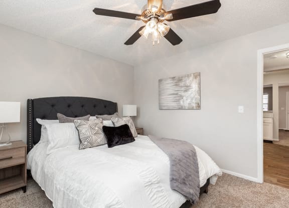 Bedroom with Plush Carpet and Ceiling Fan and Light