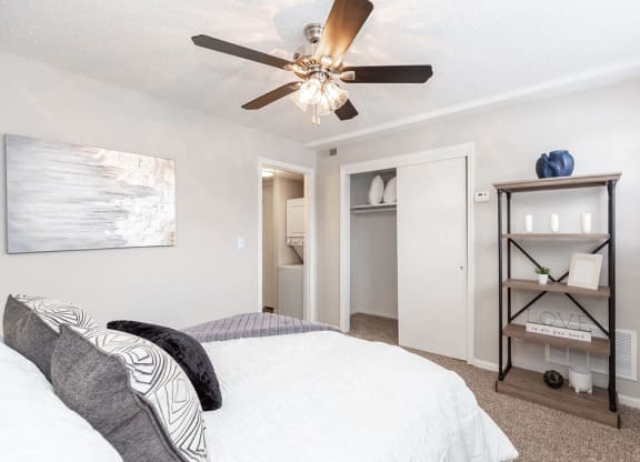 Bedroom with Sliding Closet Doors and Ceiling Fan with Light
