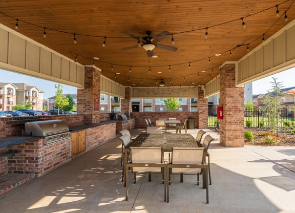 BBQ and Picnic Area with String Lights and Ceiling Fans
