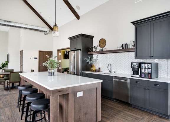 Clubhouse Kitchen with Large Kitchen Island and Bar Stool Seating