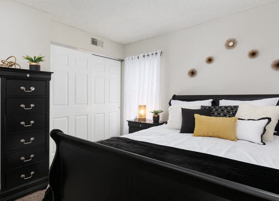 Bedroom with Sliding White Closet Doors