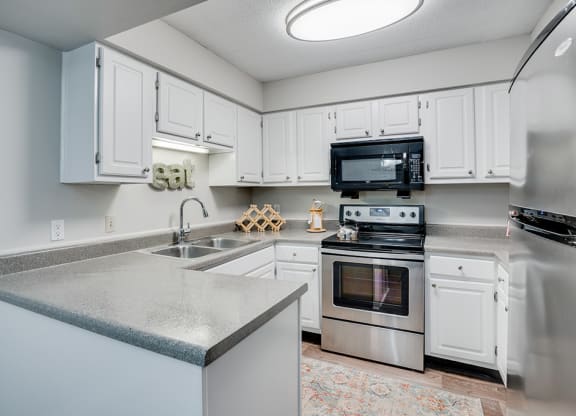 Kitchen with Stainless Steel Appliances and White Cabinetry