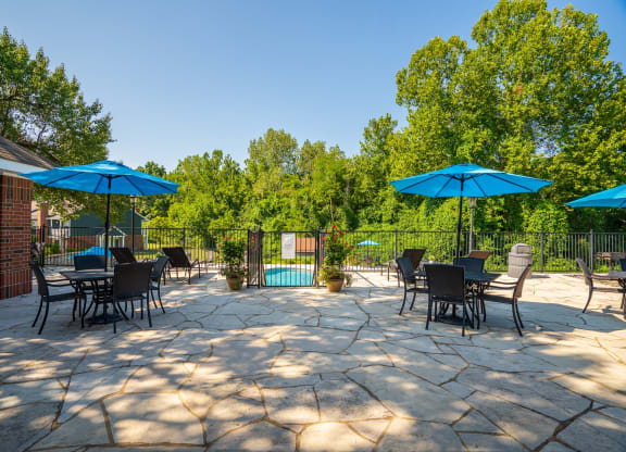 Sundeck Lounge Area With Tables & Umbrellas