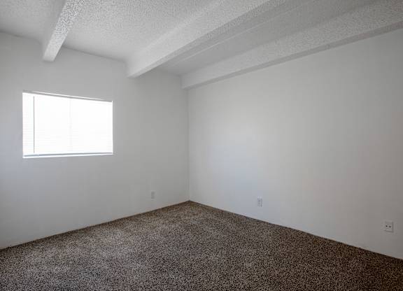 Bedroom with carpet at Los Altos Towers Apartments in Albuquerque NM