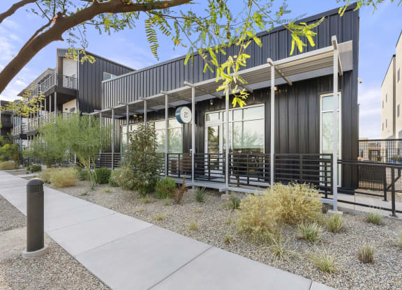 the exterior of a building with tables outside and a sidewalk at SECOND AVE COMMONS | BRAND-NEW, Arizona, 85210