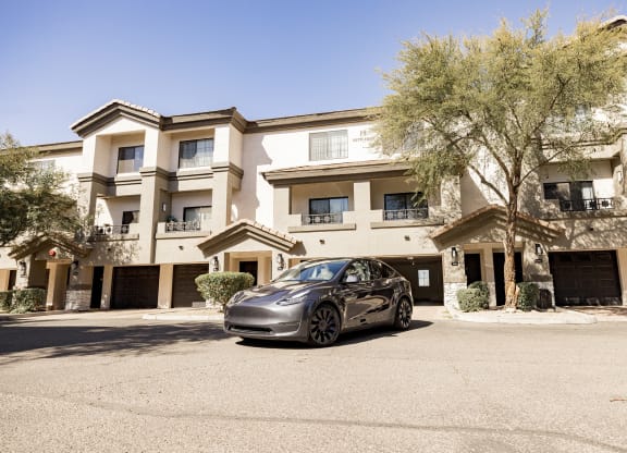 Exterior with Tesla at Haven Townhomes at P83 in Peoria Arizona