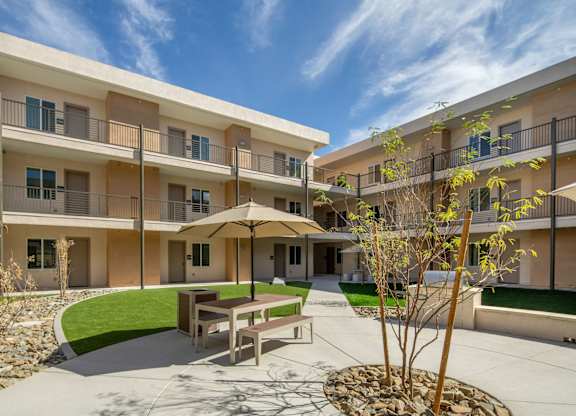 A sunny day at the courtyard of apartment buildings.