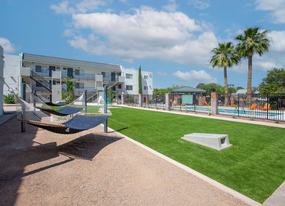 Hammock Lounge Area and Cornhole Playing Area at The Link at 4th Ave Apartments