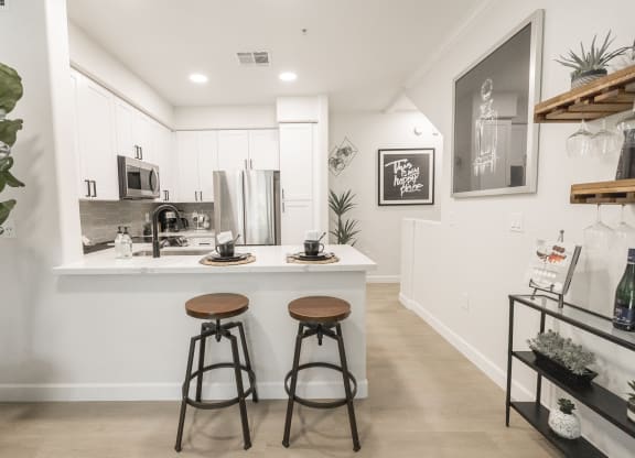 Kitchen with Breakfast Bar at Haven Townhomes at P83 in Peoria Arizona