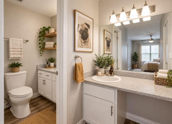 A bathroom with a white toilet, a sink, and a mirror.