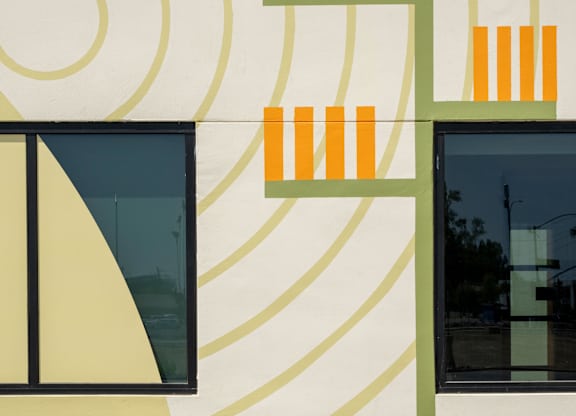 A wall with a pattern of circles and rectangles.