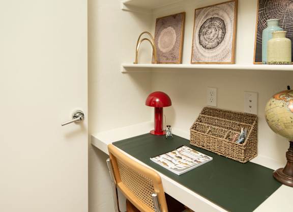A small room with a desk and chair.
