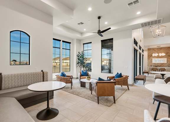 A living room with a white ceiling and a large window.