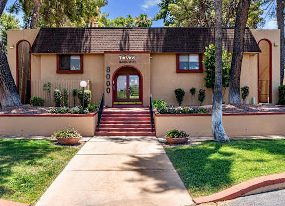A house with a red door and a sign that says "The View".