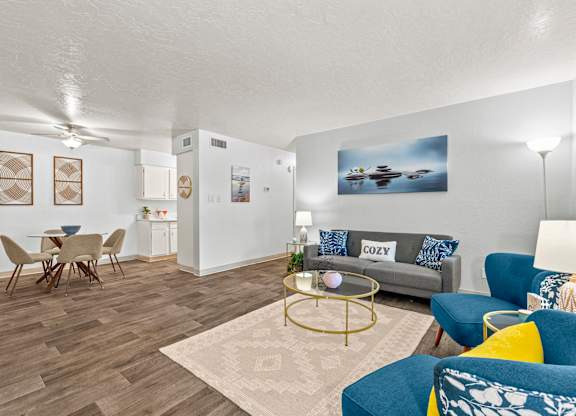A living room with a grey couch and a coffee table.