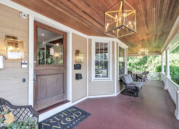 A wooden deck with a bench and a chandelier. at Ardenwood Apartments, North Haven