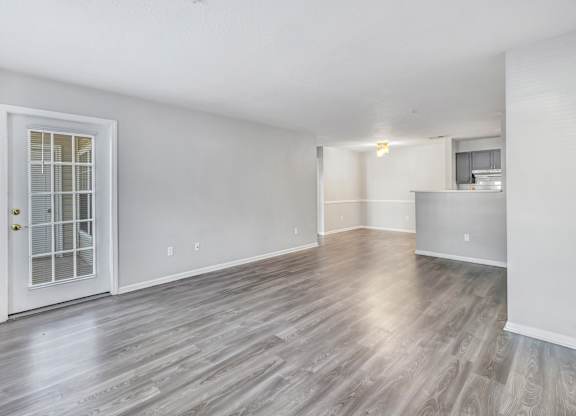 A room with a wooden floor and a white door. at Ardenwood Apartments, North Haven, Connecticut, 06473
