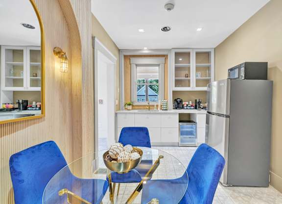 A modern kitchen with a dining table  at Ardenwood Apartments, North Haven, CT