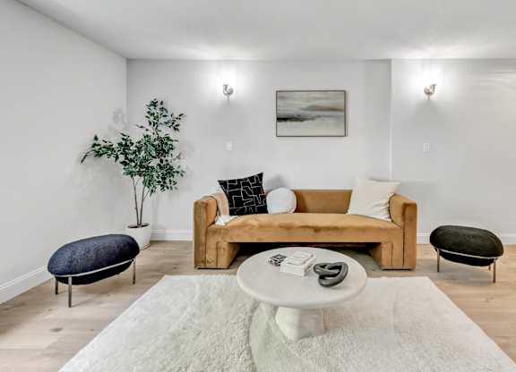 a living room with a couch and a coffee table at The Meriden, Connecticut