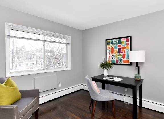 a living room with a couch and a desk and a window at Encore 99, Connecticut, 06512