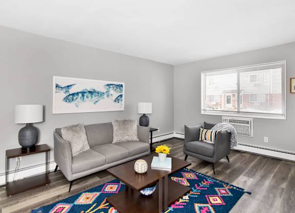 a living room with a couch and a coffee table at Encore 99, East Haven, Connecticut