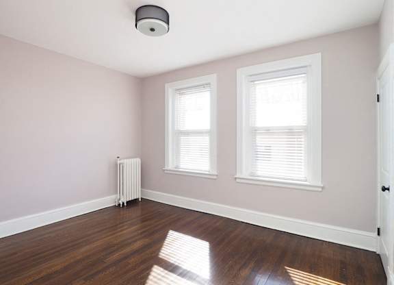 Room with window and wooden floor at The Packard, West Hartford