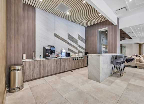 a lobby with a bar and a couch at Up House, Farmington, CT