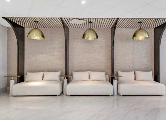 a seating area with two couches and three lamps at Up House, Farmington, Connecticut