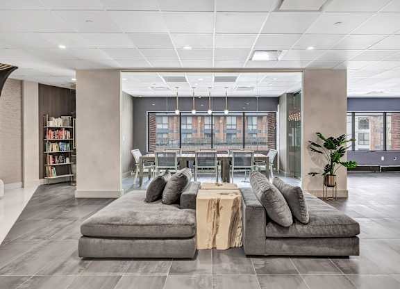 a lobby of an office building with couches and a table at Up House, Farmington, CT, 06032