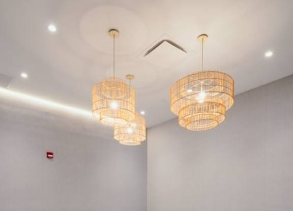 an empty room with two chandeliers and a rug at Up House, Farmington, Connecticut