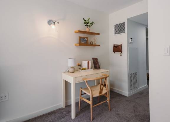 a desk with a chair and a mirror in a room at Up House, Farmington, CT