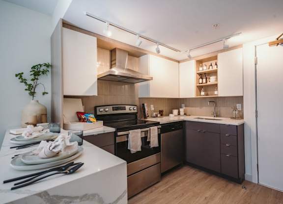 a kitchen with a stove and a sink at Up House, Farmington, CT