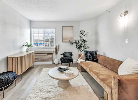 a living room with a couch and a coffee table at The Meriden, Connecticut, 06450
