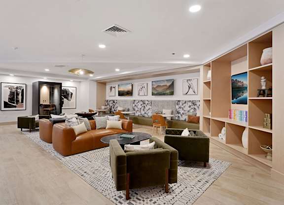 A living room with a large couch and a coffee table.