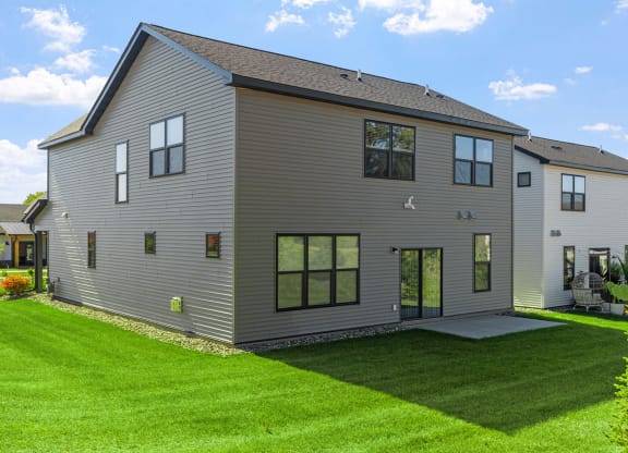 a large house with a yard in front of it