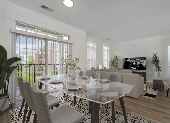 a living room with a glass table and a couch and a tv