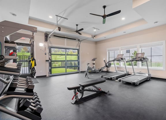 a gym with treadmills and other exercise equipment